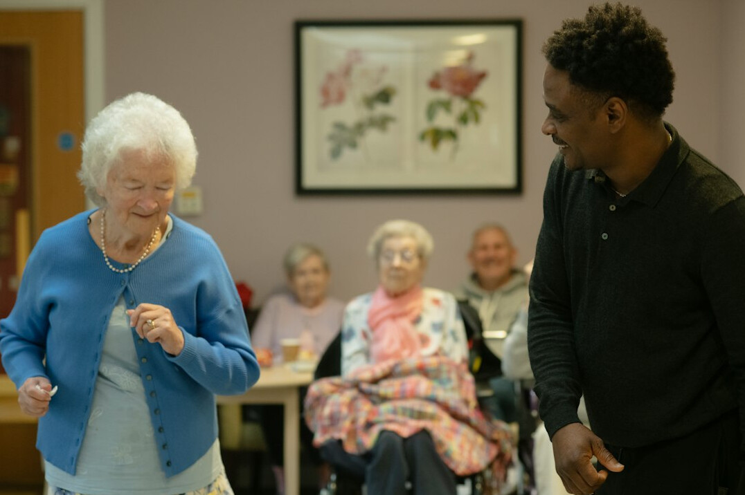 elderly people exercising together