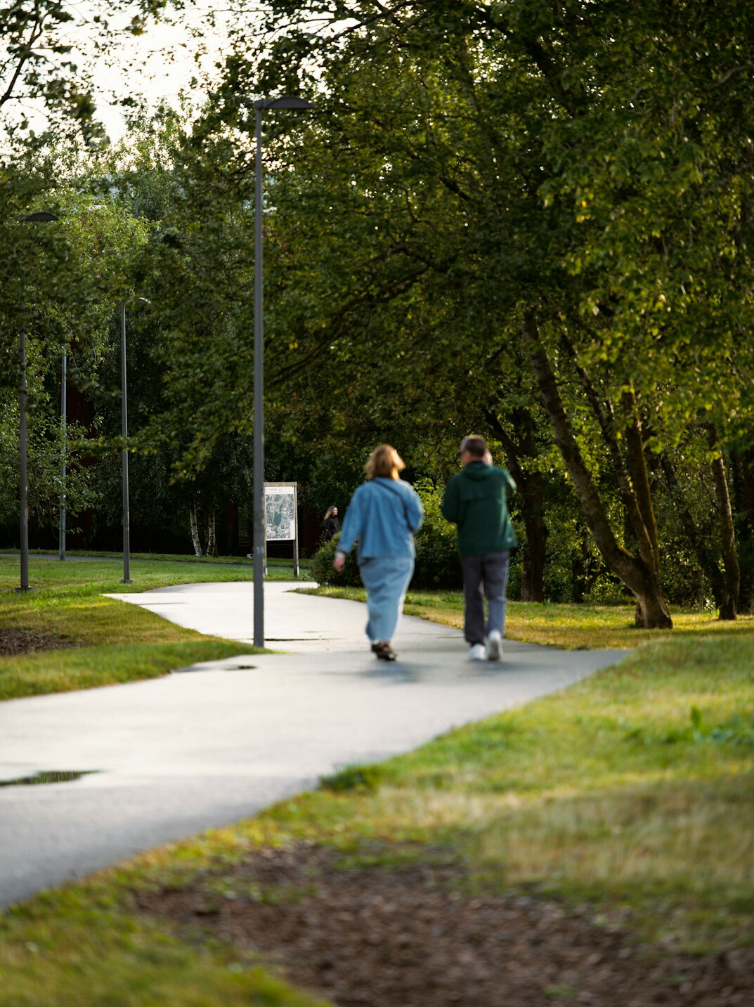 elderly couple walking in park