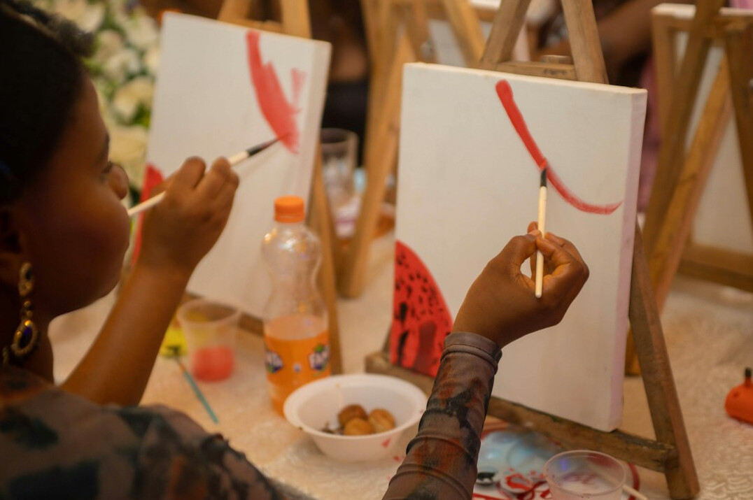 Older adults painting together in an art workshop